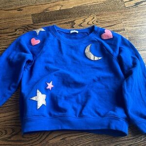 Worn twice. Beautiful crew cuts sweatshirt with moons stars and hearts.